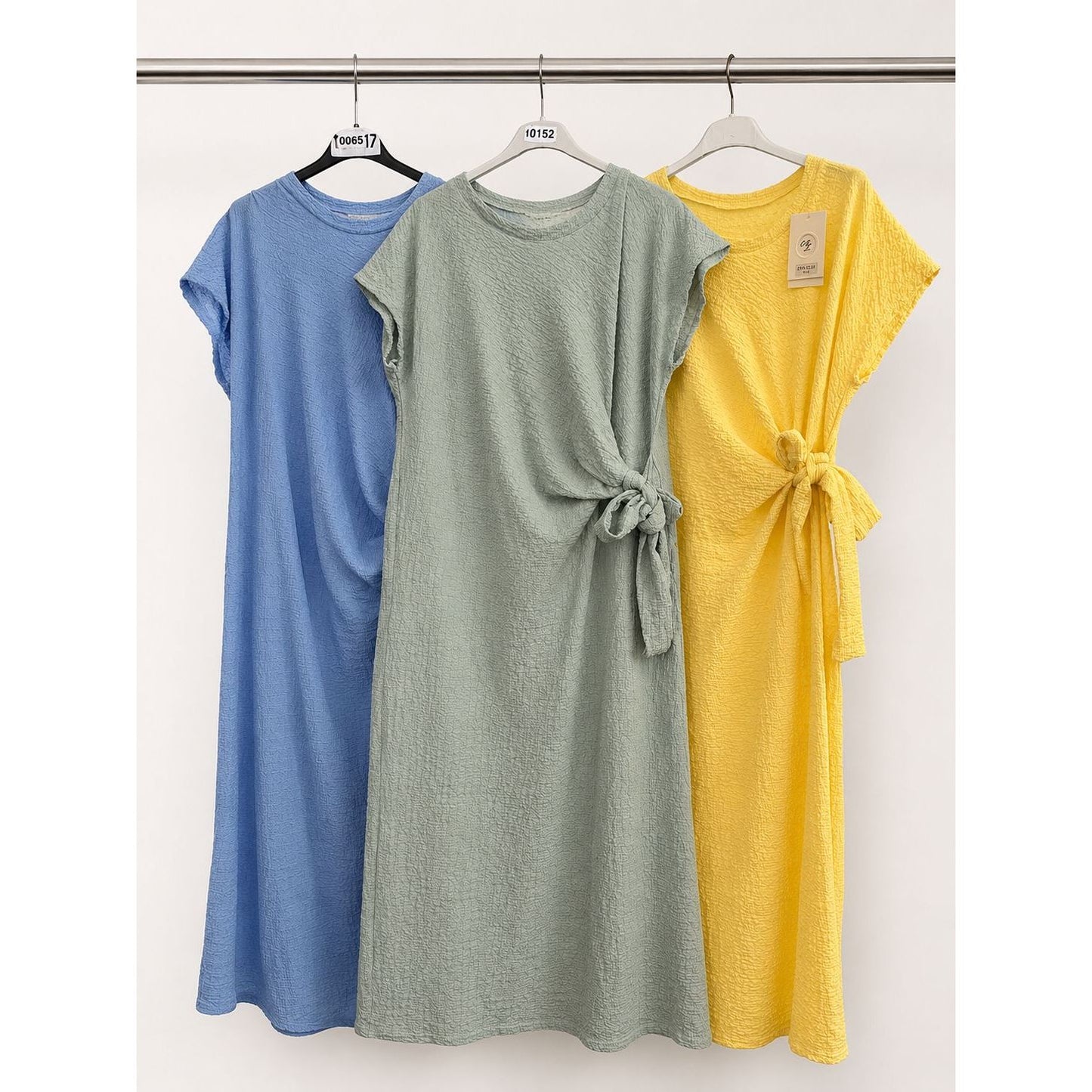 Waffle side tie dress with flattering side tie detail in blue, sage green and yellow. Soft stretchy textured fabric. One size fits up to UK 18.