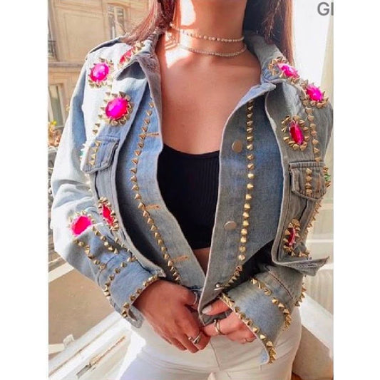 Light wash denim jacket featuring oversized fuchsia crystal embellishments, gold stud detailing and sparkling jewel accents. Was £35, now £22.