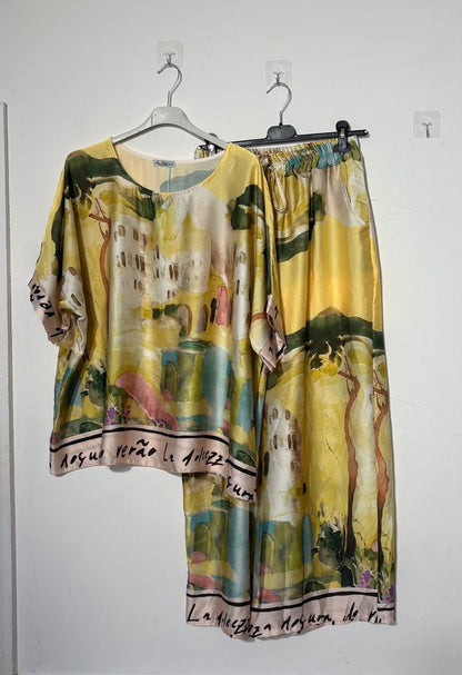 Women’s satin abstract-print two-piece set with a relaxed top and matching wide-leg trousers.
