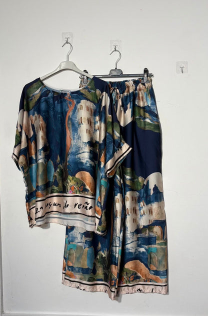 Women’s satin abstract-print two-piece set with a relaxed top and matching wide-leg trousers.
