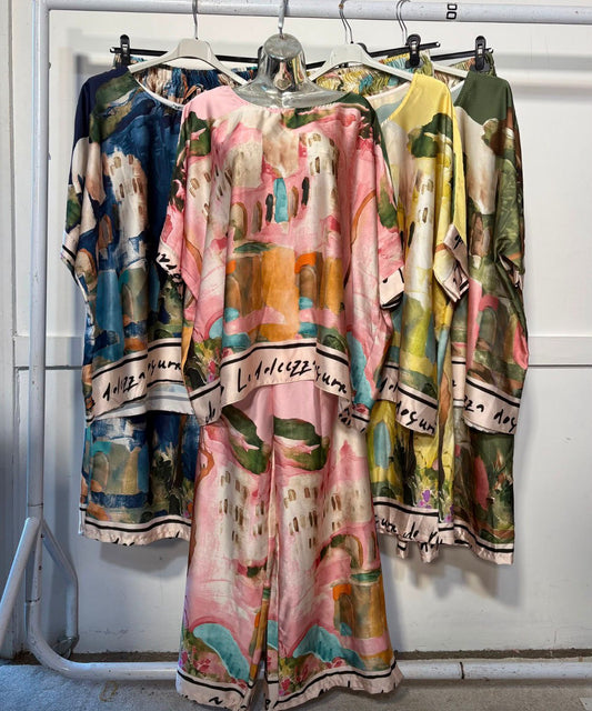 Women’s satin abstract-print two-piece set with a relaxed top and matching wide-leg trousers.
