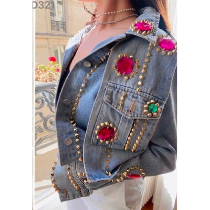 Light wash denim jacket featuring oversized fuchsia crystal embellishments, gold stud detailing and sparkling jewel accents. Was £35, now £22.