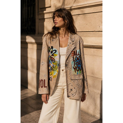 Beige graffiti print statement blazer with paisley design and colourful artwork on the front and back.
