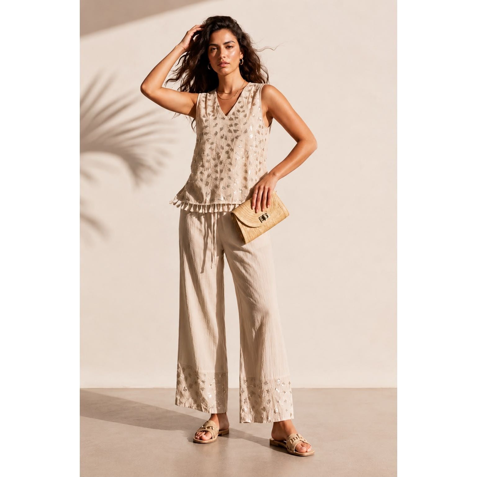Model wearing the embroidered tassel wide leg trouser set in beige with matching wide leg trousers. Available in beige, mint and baby blue