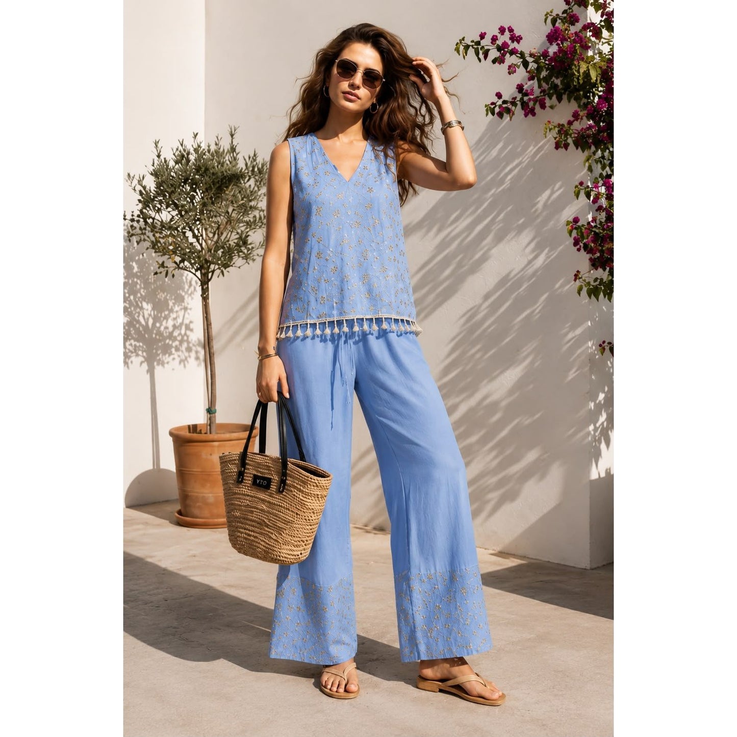 Model wearing the embroidered tassel wide leg trouser set in beige with matching wide leg trousers. Available in beige, mint and baby blue