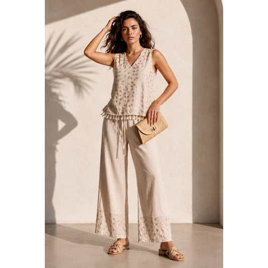 Model wearing the embroidered tassel wide leg trouser set in beige with matching wide leg trousers. Available in beige, mint and baby blue