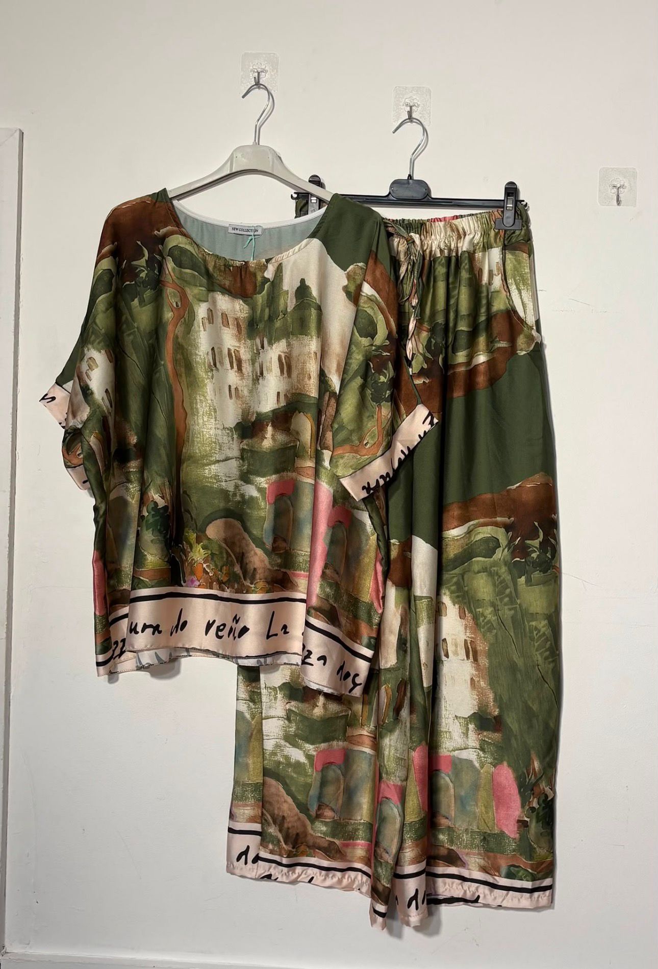 Women’s satin abstract-print two-piece set with a relaxed top and matching wide-leg trousers.
