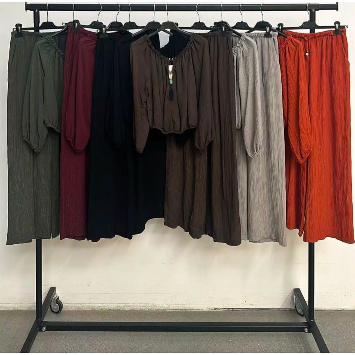 Shimmer two-piece trouser set with an off-the-shoulder top and wide-leg trousers, available in Khaki, Burgundy, Black, Chocolate Brown, Grey and Rust from Miss Foxy Boutique.