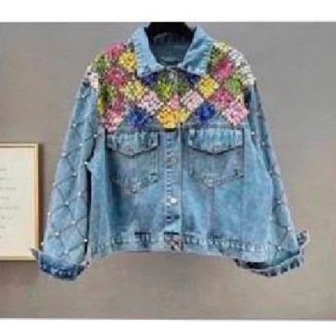 Denim jacket featuring multi-coloured crystal floral embellishments across the shoulders and pearl detailing on the sleeves. Was £35, now